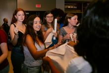 Students waiting in line to take Homecoming merch at Homecoming Live